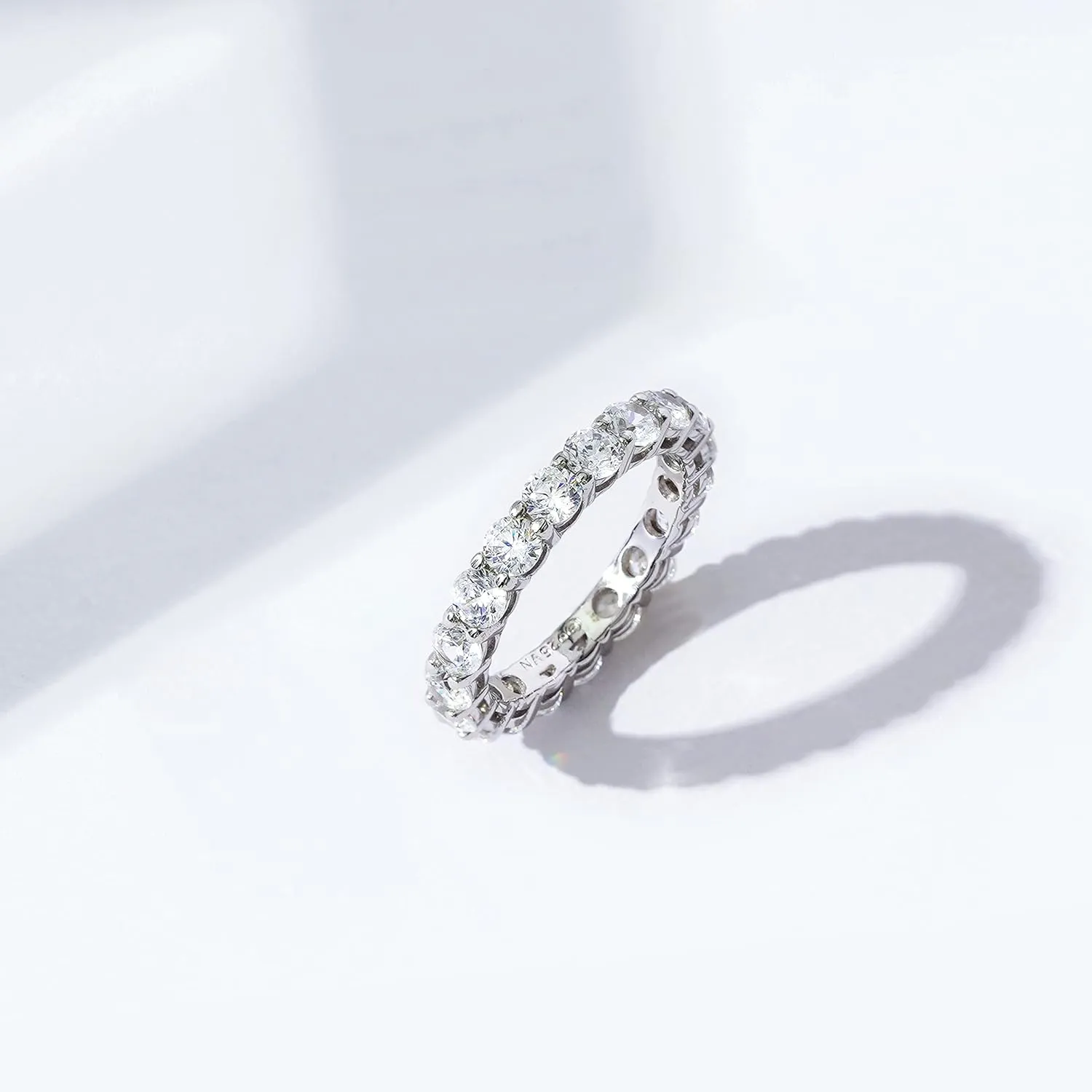 Amazon Essentials Platinum or Gold Plated Sterling Silver All-Around Band Ring set with Round Infinite Elements Cubic Zirconia (previously Amazon Collection)