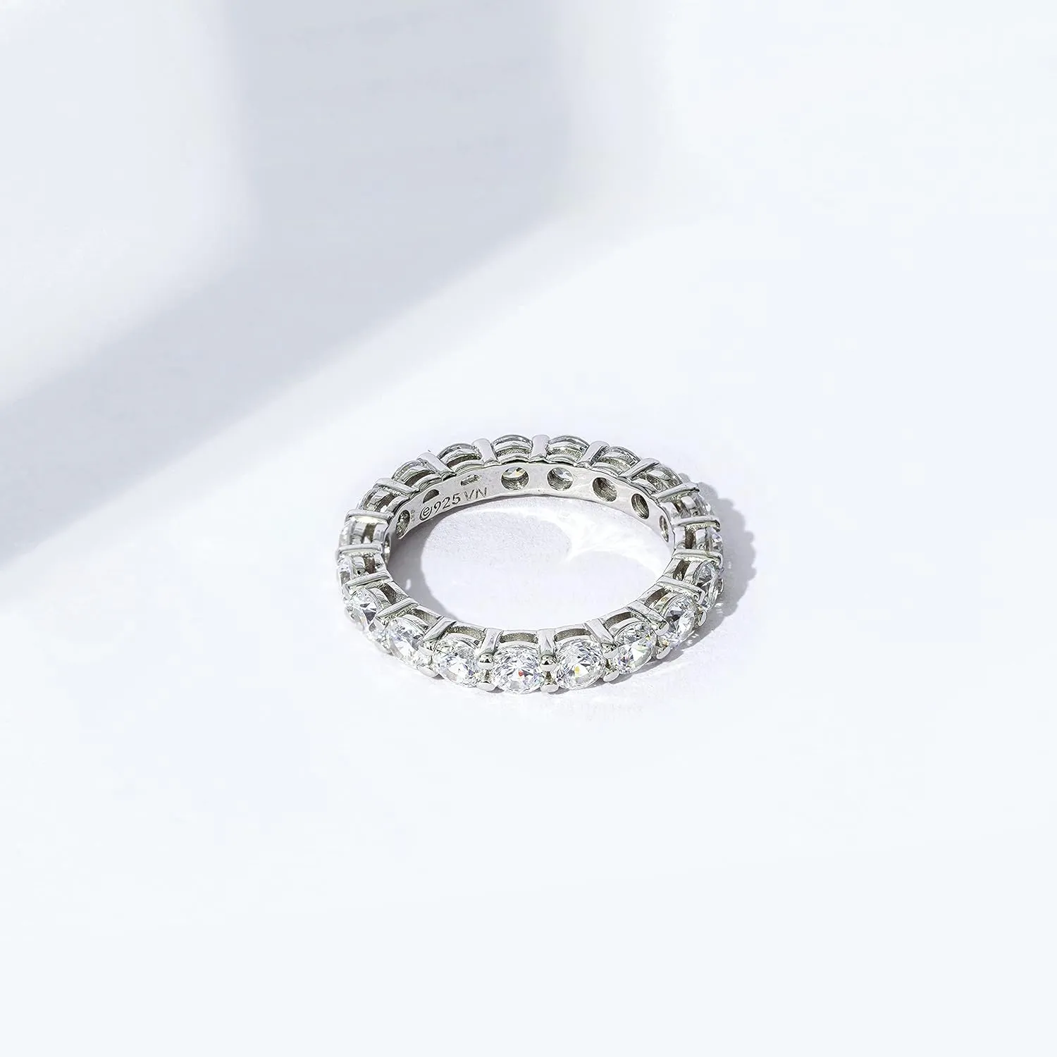 Amazon Essentials Platinum or Gold Plated Sterling Silver All-Around Band Ring set with Round Infinite Elements Cubic Zirconia (previously Amazon Collection)