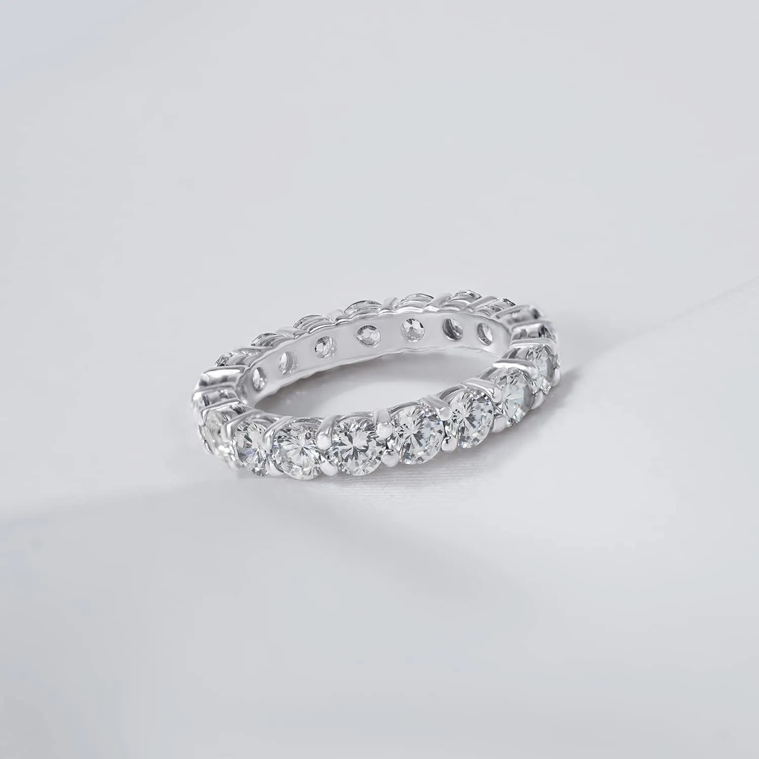 Amazon Essentials Platinum or Gold Plated Sterling Silver All-Around Band Ring set with Round Infinite Elements Cubic Zirconia (previously Amazon Collection)