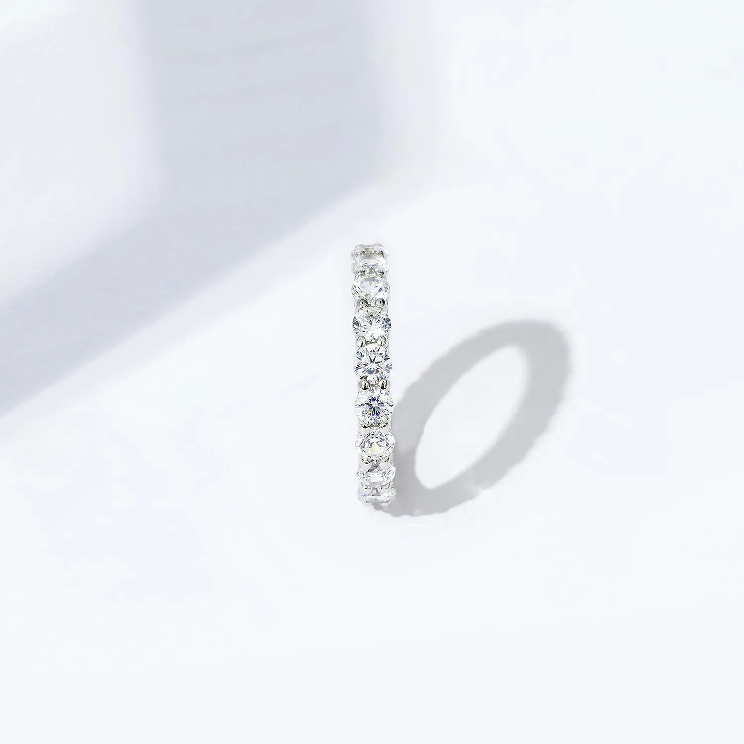 Amazon Essentials Platinum or Gold Plated Sterling Silver All-Around Band Ring set with Round Infinite Elements Cubic Zirconia (previously Amazon Collection)